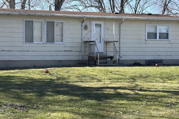 This photo taken on Tuesday, March 19, 2024, shows a house in Zearing, Iowa, where four members of a family were accused of abducting and badly abusing another relative. The 18-year-old victim suffered a brain bleed and other injuries. Court documents say the teen weighed just 70 pounds (32 kilograms) when he showed up at a hospital. (AP Photo/Hannah Fingerhut)