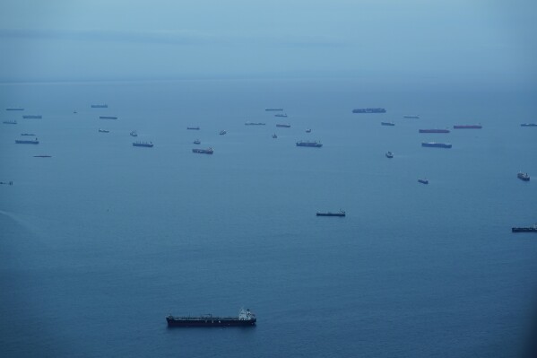 Cargo ships wait in Panama Bay for their transit through the Panama Canal in Panama City, Saturday, Sept. 23, 2023. (AP Photo/Arnulfo Franco)