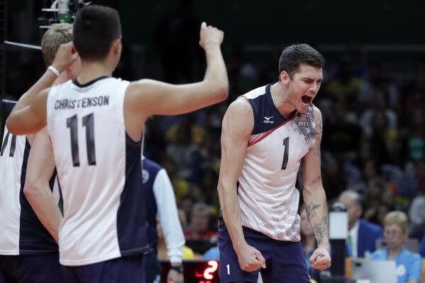 United States' Matthew Anderson, right, and Micah Christenson, left, celebrate during a men's preliminary volleyball match against Brazil at the 2016 Summer Olympics in Rio de Janeiro, Brazil, Friday, Aug. 12, 2016. (AP Photo/Jeff Roberson)