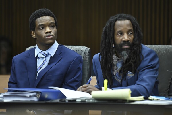 Defendant Jaylin Brazier, left, and his attorney, Brian Brown, right, listen as Asst. Wayne County Prosecutor Ryan Elsey questions prospective jurors during the jury selection for his murder trial in the death of his cousin Zion Foster at Frank Murphy Hall of Justice on Monday, May 6, 2024, in Detroit. (Clarence Tabb Jr./Detroit News via AP)