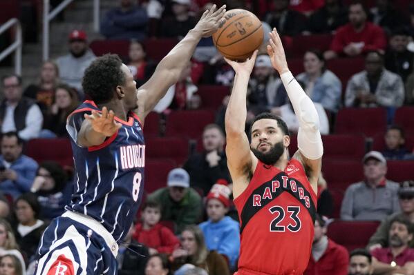 Toronto Raptors guard Fred VanVleet (23) shoots a three point basket as Houston Rockets forward Jae'Sean Tate defends during the first half of an NBA basketball game, Friday, Feb. 3, 2023, in Houston. (AP Photo/Eric Christian Smith)