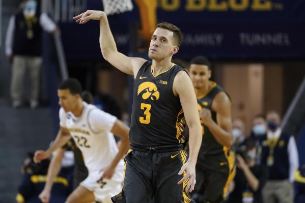 Iowa guard Jordan Bohannon reacts to a three-point basket against Michigan in the second half of an NCAA college basketball game in Ann Arbor, Mich., Thursday, March 3, 2022. (AP Photo/Paul Sancya)