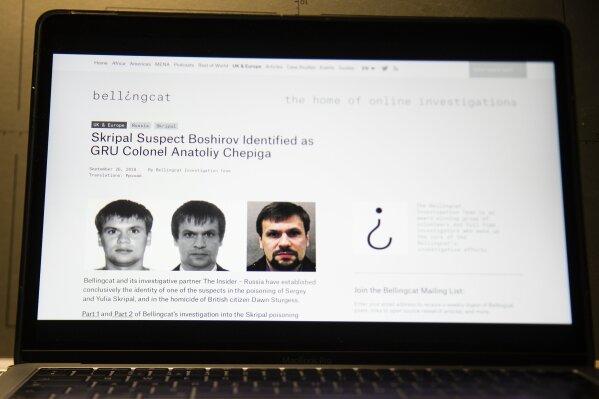 
              A web site of the British investigative group Bellingcat is seen on a computer screen in Moscow, Russia, Thursday, Sept. 27, 2018. An investigative group in Britain named Bellingcat said one of the two suspects in the March poisoning of Sergei Skripal and his daughter in the U.K. is in fact Col. Anatoliy Chepiga with the Russian military intelligence agency GRU, who in 2014 was awarded Russia's highest medal. (AP Photo/Alexander Zemlianichenko)
            