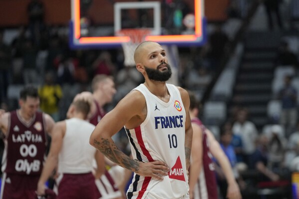 France guard Evan Fournier (10) reacts following his team's loss to Latvia during during their Basketball World Cup group H match at the Indonesia Arena stadium in Jakarta, Indonesia, Sunday, Aug. 27, 2023. (AP Photo/Achmad Ibrahim)