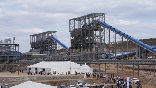 People are seen on the grounds of Prospect Lithium Zimbabwe's processing plant in Goromonzi about 80 kilometers southeast of the capital Harare, Wednesday, July 5 2023. A Chinese mining company on Wednesday commissioned a $300 million lithium processing plant in Zimbabwe. Zimbabwe has one of the world’s largest reserves of the metal, which has seen a surge in demand globally due to its use in batteries in electric cars. (AP Photo/Tsvangirayi Mukwazhi)