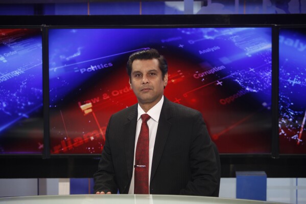 FILE - Senior Pakistani journalist Arshad Sharif poses for a photograph prior to recording an episode of his talk show at a studio in Islamabad, Pakistan, on Dec. 15, 2016. An elite Kenyan police squad went on trial in Tuesday, Oct. 31, 2023, on charges of wrongful death in the killing Sharif, a prominent Pakistani journalist, a year ago. The case was filed by the journalist's widow. (AP Photo, File)