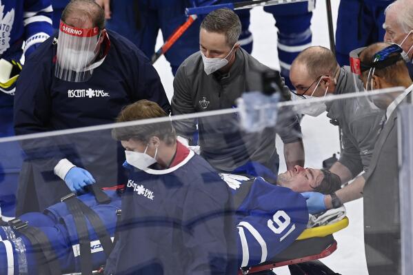Toronto Maple Leafs forward John Tavares (91) is helped onto a stretcher after being injured during the first period against the Montreal Canadiens in Game 1 of an NHL hockey Stanley Cup first-round playoff series Thursday, May 20, 2021, in Toronto. (Frank Gunn/The Canadian Press via AP)