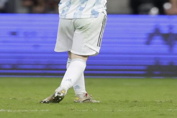 Blood is seen in an ankle of Argentina's Lionel Messi as he reacts during a Copa America semifinal soccer match against Colombia at the National stadium in Brasilia, Brazil, Tuesday, July 6, 2021. (AP Photo/Eraldo Peres)
