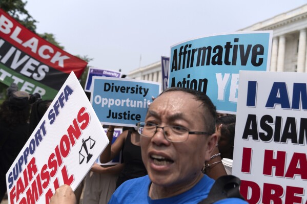 Demonstrators protest outside of the Supreme Court in Washington, Thursday, June 29, 2023, after the Supreme Court struck down affirmative action in college admissions, saying race cannot be a factor. (AP Photo/Jose Luis Magana)