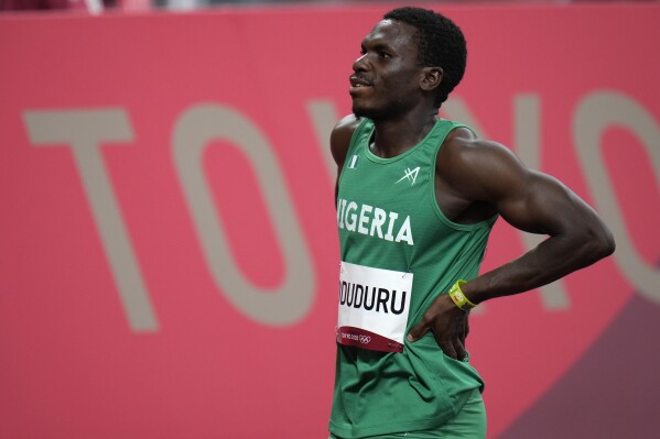 FILE - Divine Oduduru, of Nigeria, walks from the track at the 2020 Summer Olympics, on July 31, 2021, in Tokyo. Oduduru received a six-year ban for his role in a case first pursued by U.S. authorities under a law designed to combat widespread doping schemes across the globe. The Athletics Integrity Unit, which oversees doping cases in track and field, said Thursday, Oct. 12, 2023 a disciplinary panel had found the Nigerian sprinter guilty of possession and use or attempted use of multiple prohibited substances in the leadup to the 2020 Tokyo Olympics. (AP Photo/Jae C. Hong, File)