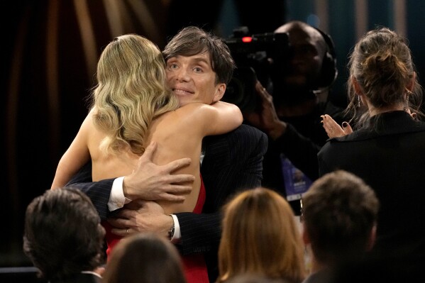 Cillian Murphy, right, and Emily Blunt embrace during the 30th annual Screen Actors Guild Awards on Saturday, Feb. 24, 2024, at the Shrine Auditorium in Los Angeles. (AP Photo/Chris Pizzello)