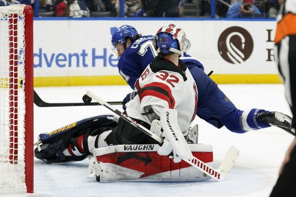 New Jersey Devils goaltender Jon Gillies (32) makes a stick save on a penalty shot by Tampa Bay Lightning center Anthony Cirelli (71) during the second period of an NHL hockey game Thursday, Jan. 27, 2022, in Tampa, Fla. (AP Photo/Chris O'Meara)