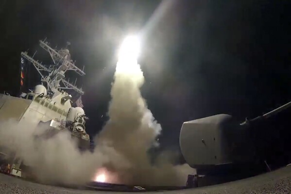 FILE - In this file image from video provided by the U.S. Navy, the guided-missile destroyer USS Porter (DDG 78) launches a tomahawk land attack missile in the Mediterranean Sea, on April 7, 2017. Japan’s defense ministry is requesting a nearly 12% budget increase that includes two warships with advanced radar and long-range cruise missiles as it further fortifies the nation's military in the face of North Korean threats and Chinese military advancement. (Mass Communication Specialist 3rd Class Ford Williams/U.S. Navy via AP, File)
