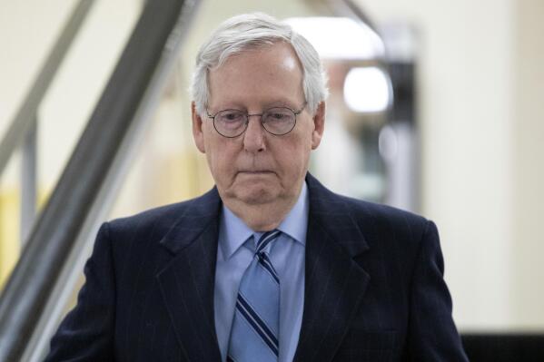 Senate Minority Leader Mitch McConnell, R-Ky. goes down an escalator at the Capitol in Washington, Wednesday, Jan. 19, 2022. (AP Photo/Amanda Andrade-Rhoades)