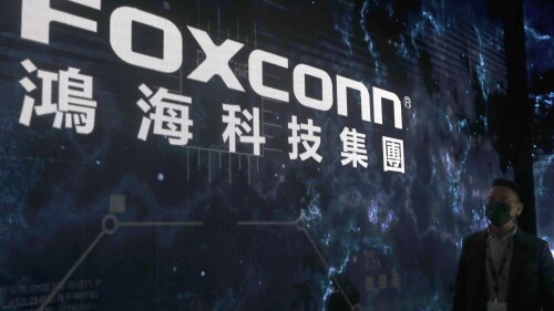 FILE - The Foxconn logo is seen during the Hon Hai Tech Day at the Nangang Exhibition Center in Taipei, Taiwan, on Oct. 18, 2022. Taiwan-based electronics giant Foxconn is backing out of a $19.5 billion semiconductor joint venture with Indian mining conglomerate Vedanta Ltd. India’s government leaders say they aren't too worried about the impact. (AP Photo/Chiang Ying-ying, File)