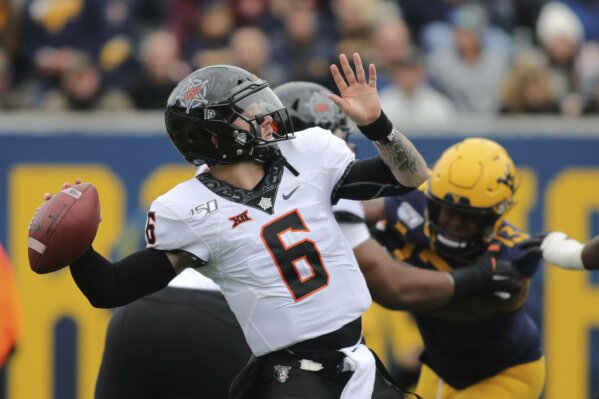 Gordon guides Oklahoma State to fifth straight win in Morgantown