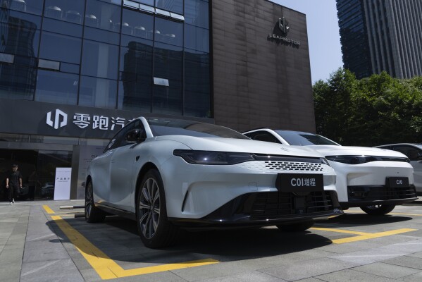 Leapmotor vehicles are parked outside a showroom in Hangzhou in eastern China's Zhejiang province on Tuesday, May 14, 2024. European carmaker Stellantis on Tuesday said it had formed a joint venture with the Chinese electric vehicle startup Leapmotor that will begin selling EVs in nine European countries later this year. (AP Photo/Caroline Chen)