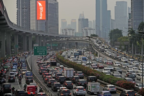 Vehicles are caught in a congestion during rush hour in Jakarta, Indonesia, on Oct. 27, 2023. Pollution is causing respiratory illnesses and deaths to rise in Indonesia's island of Java, including the capital, Jakarta. Data gathered by IQAir, a Swiss air technology company, regularly ranks Jakarta as one of the most polluted cities in the world. Blue skies are a rare sight and the air often smells like fuel or heavy smoke. (AP Photo/Achmad Ibrahim)