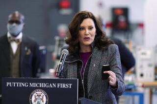 FILE - Michigan Gov. Gretchen Whitmer addresses business leaders, Monday, Dec. 20, 2021, in Detroit. Michigan public schools can use non-teaching staff as substitute teachers the rest of the academic year under a law designed to address a shortage during the coronavirus pandemic. Democratic Gov. Whitmer announced Monday, Dec. 27, that she signed the bill last week, calling it a “temporary stopgap." (AP Photo/Carlos Osorio, File)