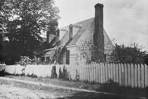 FILE- This early 1900s photo provided by the The Colonial Williamsburg Foundation shows the front of the Dudley Digges House in its original location on Prince George Street, in Williamsburg, Va. The Andrew W. Mellon Foundation has given a $5-million boost to efforts to preserve the colonial-era schoolhouse where enslaved and free Black children were taught in Virginia, officials announced Friday, Feb. 18, 2022.   (Courtesy of John D. Rockefeller Jr. Library/The Colonial Williamsburg Foundation via AP, File)