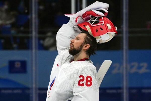 FILE - Russian Olympic Committee goalkeeper Ivan Fedotov (28) reacts after a goal by Finland's Hannes Bjorninen during the men's gold medal hockey game at the 2022 Winter Olympics, Sunday, Feb. 20, 2022, in Beijing. Fedotov has had his contract in Russia's KHL terminated by CSKA Moscow, the team announced Thursday, March 28, 2024, with one year remaining on it. The Philadelphia Flyers own Fedotov's NHL rights, signed him in May 2022 and attempted to bring him to North America a few months later. He was instead taken to a remote military base in the Arctic Circle for a year of service. (AP Photo/Petr David Josek, File)