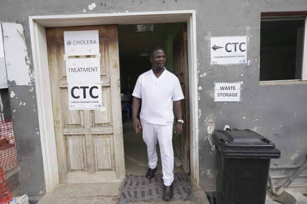 A nurse exits from a cholera treatment centre in Lusaka, Zambia, Saturday, March 9, 2024. (AP Photo/Tsvangirayi Mukwazhi)
