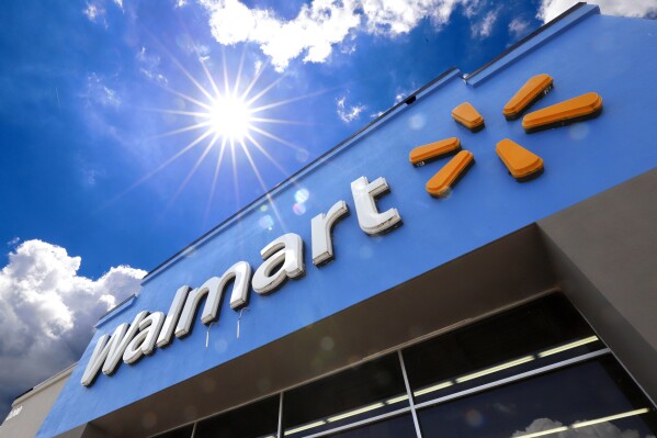 FILE - The entrance to a Walmart store is shown on June 25, 2019 in Pittsburgh. Walmart reports earning on Thursday. (AP Photo/Gene J. Puskar, File)