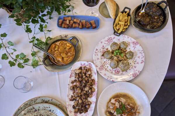 Several dishes from the restaurant's menu are photographed at Casa Pedro restaurant in Madrid, Spain, on May 16, 2025. (AP Photo/Manu Fernandez)
