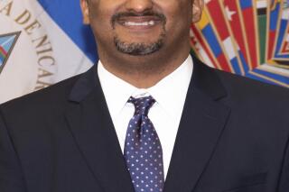 In this photo released by the The Organization of American States (OAS), Arturo McFields, ambassador of Nicaragua to the OAS, poses for a photo in Washington, Nov. 5, 2021. On March 23, 2022, McFields denounced his own government as a “dictatorship” in a dramatic break with the administration of President Daniel Ortega. (Juan Manuel Herrera/OAS via AP)