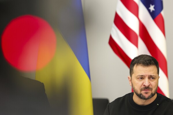 Ukraine's President Volodymyr Zelenskyy addresses the Ukraine Defense Contact Group during a meeting of NATO defense ministers at NATO headquarters in Brussels, Wednesday, Oct. 11, 2023. Ukraine's President Volodymyr Zelenskyy has arrived at NATO for meetings with alliance defense ministers to further drum up support for Ukraine's fight against Russia. (Olivier Matthys, Pool Photo via AP)