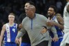 Sacramento Kings head coach Mike Brown is restrained bt Malik Monk as he argues a call during the second half of an NBA basketball game against the Milwaukee Bucks Sunday, Jan. 14, 2024, in Milwaukee. The Bucks won 143-142 in overtime. (AP Photo/Morry Gash)