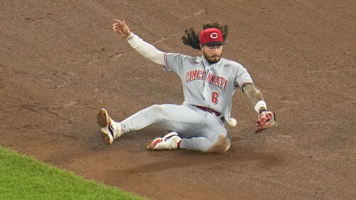 Cincinnati Reds second baseman Jonathan India makes a stop on a ground ball before throwing out Baltimore Orioles' Ryan O'Hearn at first base in the fifth inning of a baseball game, Wednesday, June 28, 2023, in Baltimore. (AP Photo/Julio Cortez)