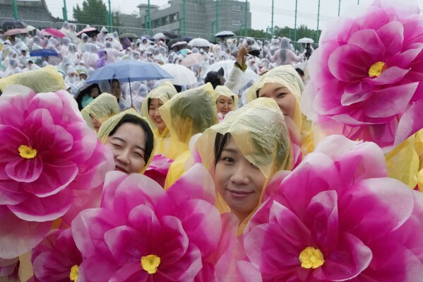 Buddhists wait for a lantern parade as part of festivities celebrating the birthday of Buddha, at Dongguk University in Seoul, South Korea, Saturday, May 11, 2024. (Ǻ Photo/Ahn Young-joon)