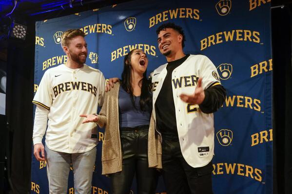 Milwaukee Brewers' Willy Adames and Owen Miller pose for a photo with a fan at a promotional event Wednesday, Jan. 18, 2023, in Milwaukee. (AP Photo/Morry Gash)