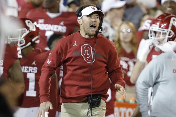 FILE - Then Oklahoma head coach Lincoln Riley yells to his team before a play during the first half of an NCAA college football game against TCU, Saturday, Oct. 16, 2021, in Norman, Okla.Riley, one of college football's most successful young coaches who won 85 percent of his games in five seasons at Oklahoma and led the Sooners to four Big 12 titles and four New Year's Six bowls with three College Football Playoff appearances, has been named the head coach at USC, athletic director Mike Bohn announced Sunday, Nov. 28, 2021. (AP Photo/Alonzo Adams, File)