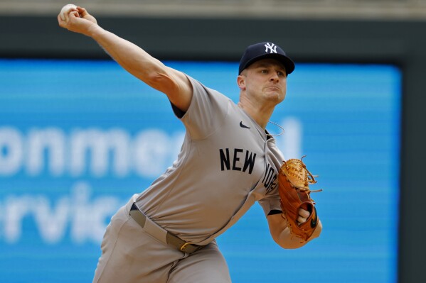 New York Yankees starting pitcher Clarke Schmidt throws to the Minnesota Twins in the first inning of a baseball game Thursday, May 16, 2024, in Minneapolis. (AP Photo/Bruce Kluckhohn)
