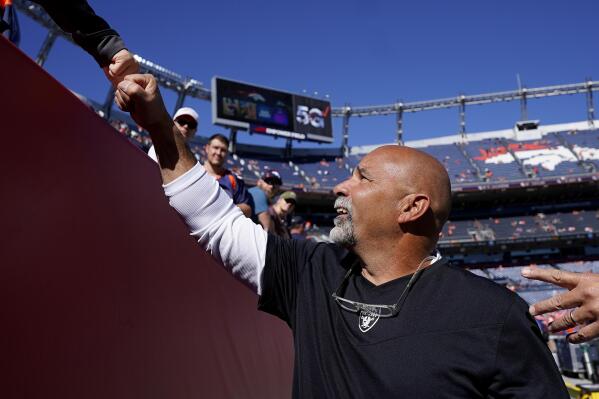 Las Vegas Raiders interim head coach Rich Bisaccia greets fans prior to an NFL football game against the Denver Broncos, Sunday, Oct. 17, 2021, in Denver. (AP Photo/Jack Dempsey)