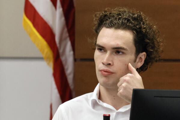 Former Marjory Stoneman Douglas High School student John Wilford testifies about encountering Nikolas Cruz at a McDonalds shortly after the school shooting. Wilford's sister Maddie was shot and severely injured in the shooting. Nikolas Cruz is in court for the penalty phase of his trial at the Broward County Courthouse in Fort Lauderdale on Thursday, July 21, 2022. Cruz previously plead guilty to all 17 counts of premeditated murder and 17 counts of attempted murder in the 2018 shootings. (Mike Stocker/South Florida Sun Sentinel via AP, Pool)