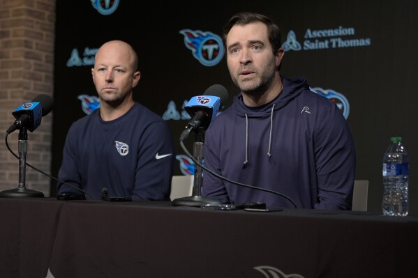 FILE - Tennessee Titans head coach Brian Callahan, right, and offensive coordinator Nick Holz respond to questions during a news conference at the NFL football team's training facility Wednesday, Feb. 14, 2024, in Nashville, Tenn. he Tennessee Titans are getting to know each other, taking full advantage of the NFL giving new coaches a week's head start to the offseason ahead of the rest of the league. They started the voluntary portion of the first phase Monday, April 8. 22024 and first-time head coach Brian Callahan is taking nothing for granted. (AP Photo/George Walker IV, File)
