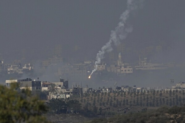 An Israeli army flare is seen over the northern part of the Gaza Strip, as seen from southern Israel, Wednesday, Nov. 1, 2023. (AP Photo/Ariel Schalit)