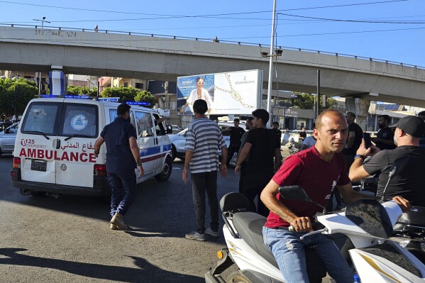 An ambulance carries wounded people whose handheld pager exploded, in Beirut, Lebanon, Tuesday, Sept. 17, 2024. (AP Photo/Hassan Ammar)