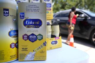 Katherine Gibson-Haynes helps distribute infant formula during a baby formula drive Saturday, May 14, 2022, in Houston. Parents seeking baby formula are running into bare supermarket and pharmacy shelves in part because of ongoing supply disruptions and a recent safety recall. (AP Photo/David J. Phillip)