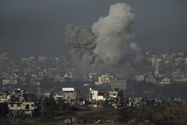 Smoke rises following an Israeli airstrike in the Gaza Strip, as seen from southern Israel, Wednesday, Nov. 22, 2023. (AP Photo/Leo Correa)