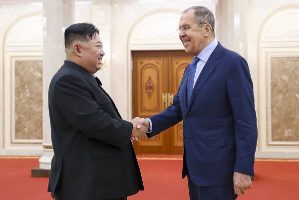 In this photo released by Russian Foreign Ministry Press Service via their telegram channel, Korean leader Kim Jong Un, left, and Russian Foreign Minister Sergey Lavrov greet each other during a meeting in Pyongyang, North Korea, on Thursday, Oct. 19, 2023. (Russian Foreign Ministry Press Service telegram channel via AP)