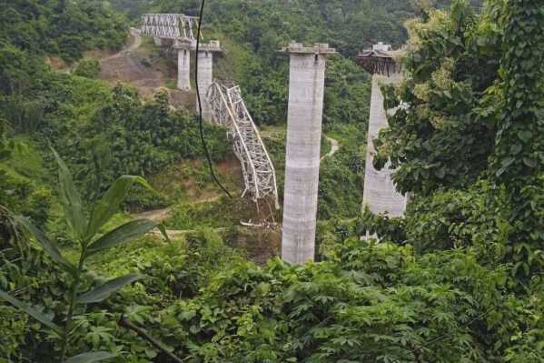 This photo posted on Mizoram Chief Minister Zoramthanga’s official account on the X platform, formerly known as Twitter, shows a collapse at an under construction railroad bridge in Sairang, on the outskirts of Aizawal, Mizoram state, India, Wednesday, Aug.23, 2023. (Mizoram Chief Minister''s X via AP)