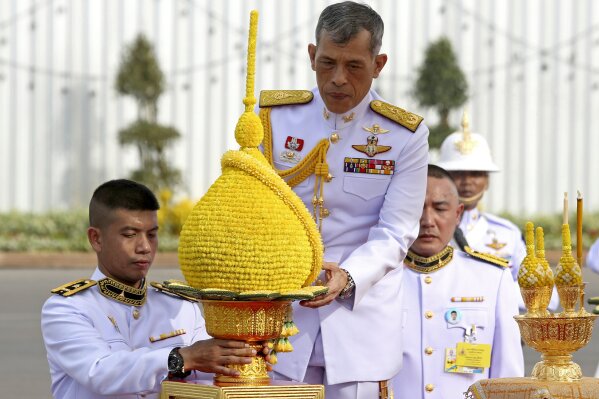 
              Thailand's King Maha Vajiralongkorn, center, pays homage to the Equestrian Statue of King Chulalongkorn in Bangkok, Thursday, May 2, 2019. The coronation ceremonies for 66-year-old King Maha Vajiralongkorn, also known as King Rama X, will be held on May 4-6, 2019. (Pool Photo via AP)
            