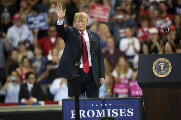 
              FILE - In this June 20, 2018 file photo, U.S. President Donald Trump waves to the crowd after speaking at a campaign rally, Wednesday, June 20, 2018, in Duluth, Minn. Trump heads back to Minnesota on the nation's tax filing deadline, Monday, April 15, 2019, eager to remind voters in a state he nearly carried in 2016 about the $1.5 trillion Republican tax cut. It's a policy achievement that won't resonate with everyone in Minnesota, where the loss of the state tax deduction hurt some taxpayers. And national polls show most Americans don't have a clear idea what the tax cuts did for them. (AP Photo/Jim Mone File)
            