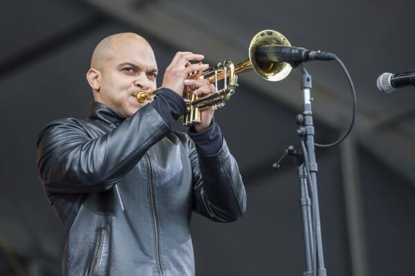 FILE - In this May 4, 2017 file photo, Irvin Mayfield performs at the New Orleans Jazz and Heritage Festival in New Orleans.  Mayfield, the jazz trumpet player who became a symbol of New Orleans resilience after Hurricane Katrina, was scheduled to be sentenced in federal court Wednesday, Nov. 3, 2021, for steering charity money meant for public libraries to his personal use.(Photo by Amy Harris/Invision/AP, File)
