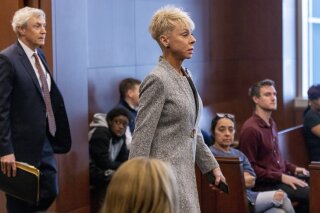 FILE - North Carolina State Auditor Beth Wood makes an appearance in Wake County Court, March 23, 2023, in Raleigh, N.C. Wood announced on Thursday, Nov. 9, that she will resign from her elected post next month, a decision coming two days after she was indicted on charges that she misused her state-owned vehicle for personal activities. (Robert Willett/The News & Observer via AP, File)