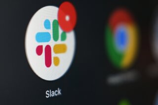 File-This Dec. 2, 2020, file photo shows the Slack app icon being displayed on a computer screen in Tokyo. Slack suffered a global outage Monday, Jan. 4, 2021,  during the first day back to work for most people after the New Year’s holiday. Users reported service was down in the U.S., Asia, Latin America Europe, and India.  (AP Photo/Kiichiro Sato, File)
